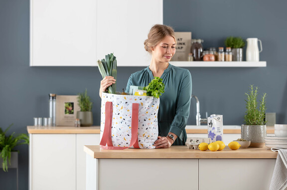 woman kitchen shopper vegetables
